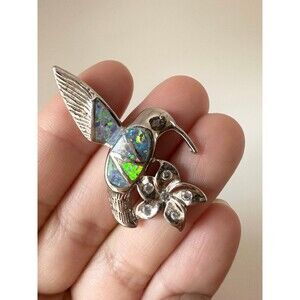 Silver tone opal hummingbird flower pendant